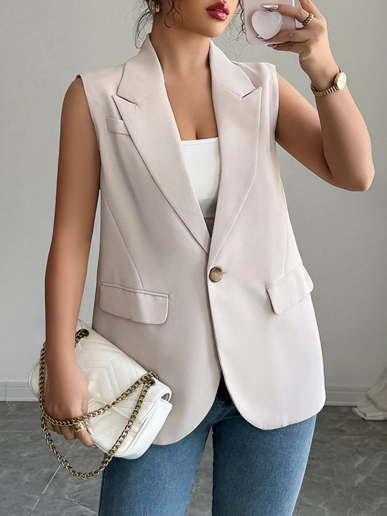 Front view of One Button Sleeveless Blazer in Eggshell.