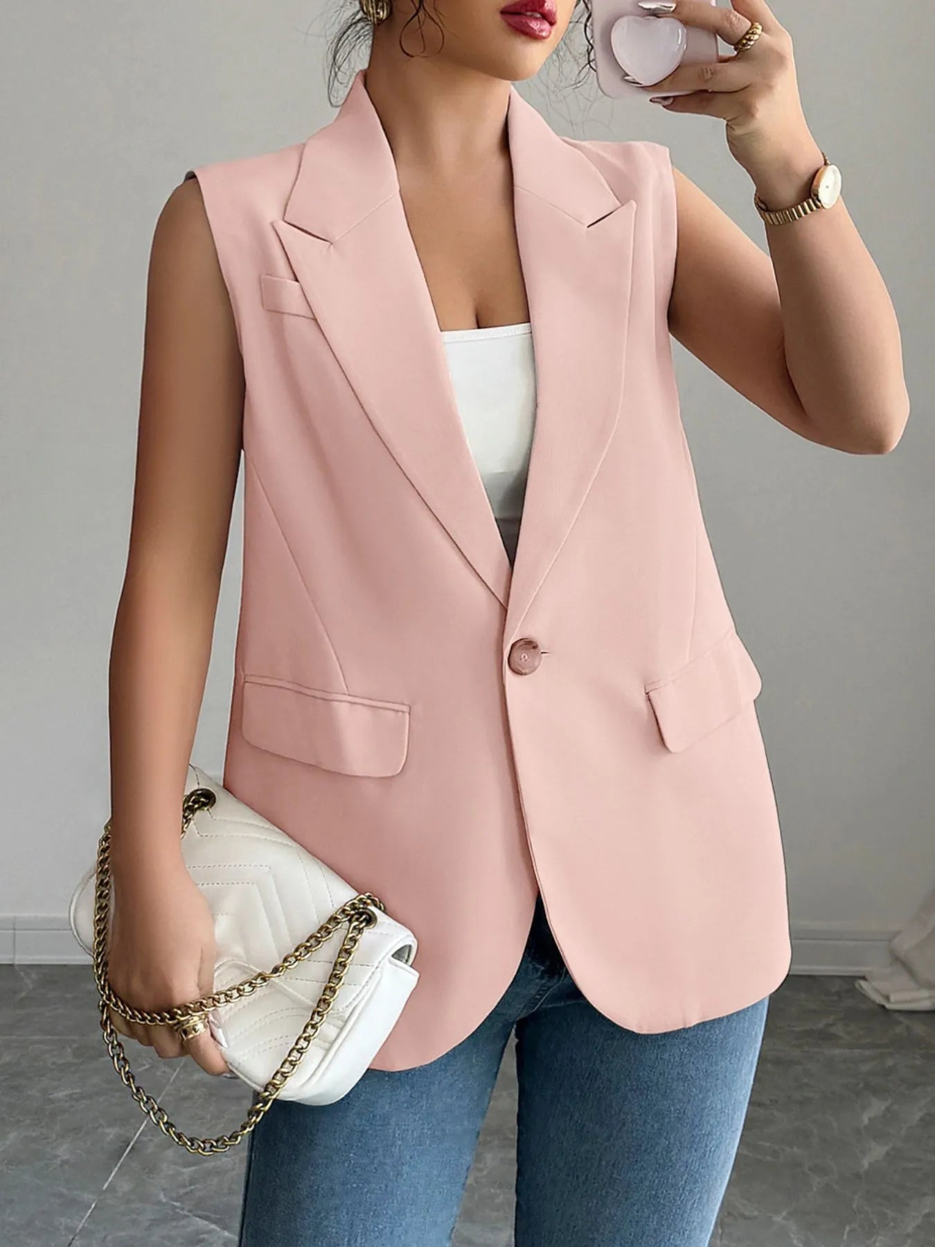 Side view showcasing the fit of One Button Sleeveless Blazer in Pale Blush.