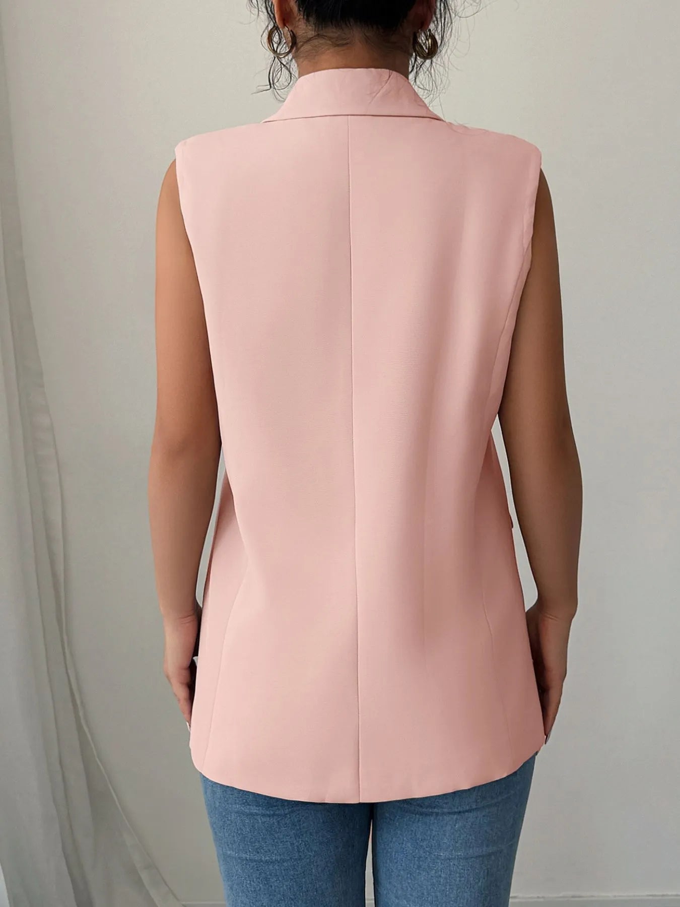 Back view highlighting the design of One Button Sleeveless Blazer in Pale Blush.
