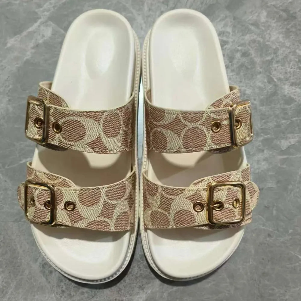 Close-up detail of buckles on beige open toe double buckle sandals