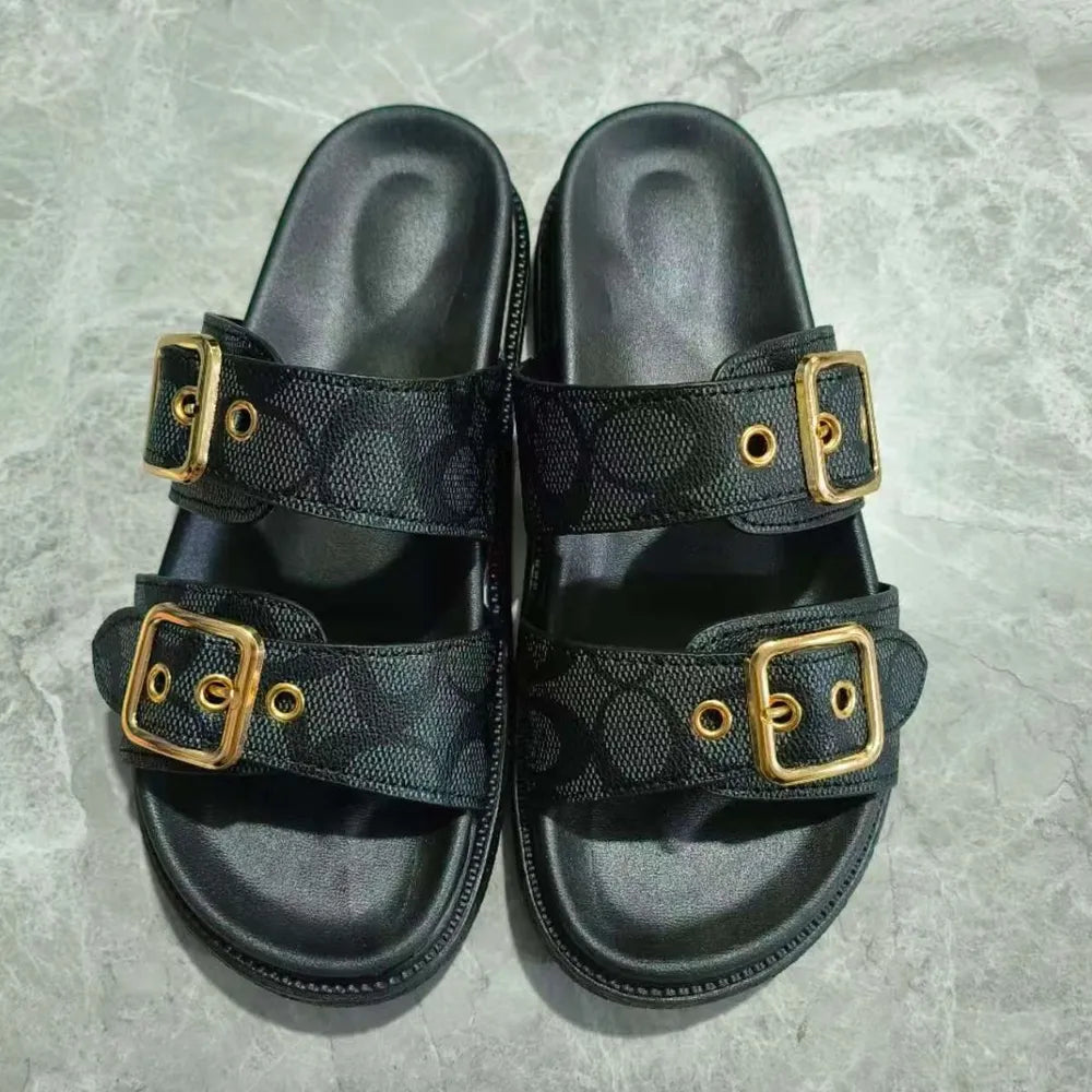 Open toe double buckle sandals in black — front view