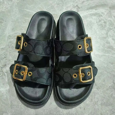 Open toe double buckle sandals in black — front view