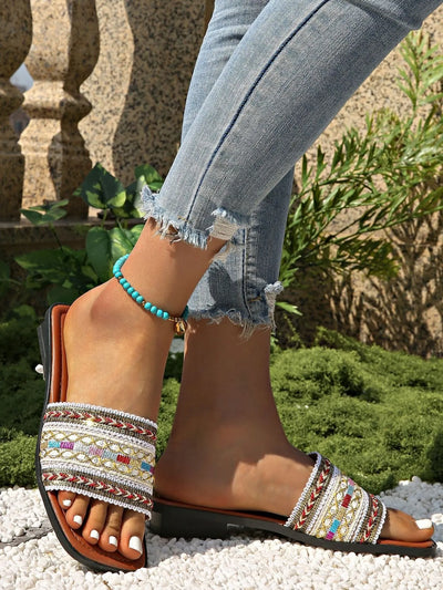 Back view of open toe flats sandals in white