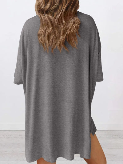 Side view of model wearing Full Size Oversized Slit Round Neck Lounge Set, highlighting the relaxed silhouette.