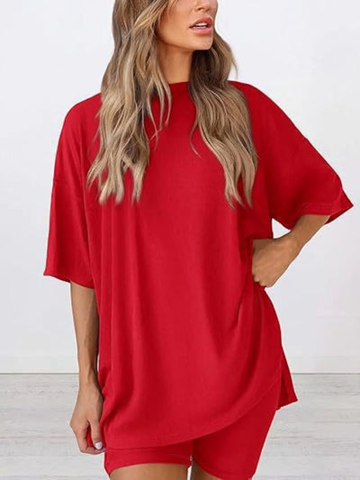 Model wearing the top from Full Size Oversized Slit Round Neck Lounge Set, showing slit and relaxed oversized fit.