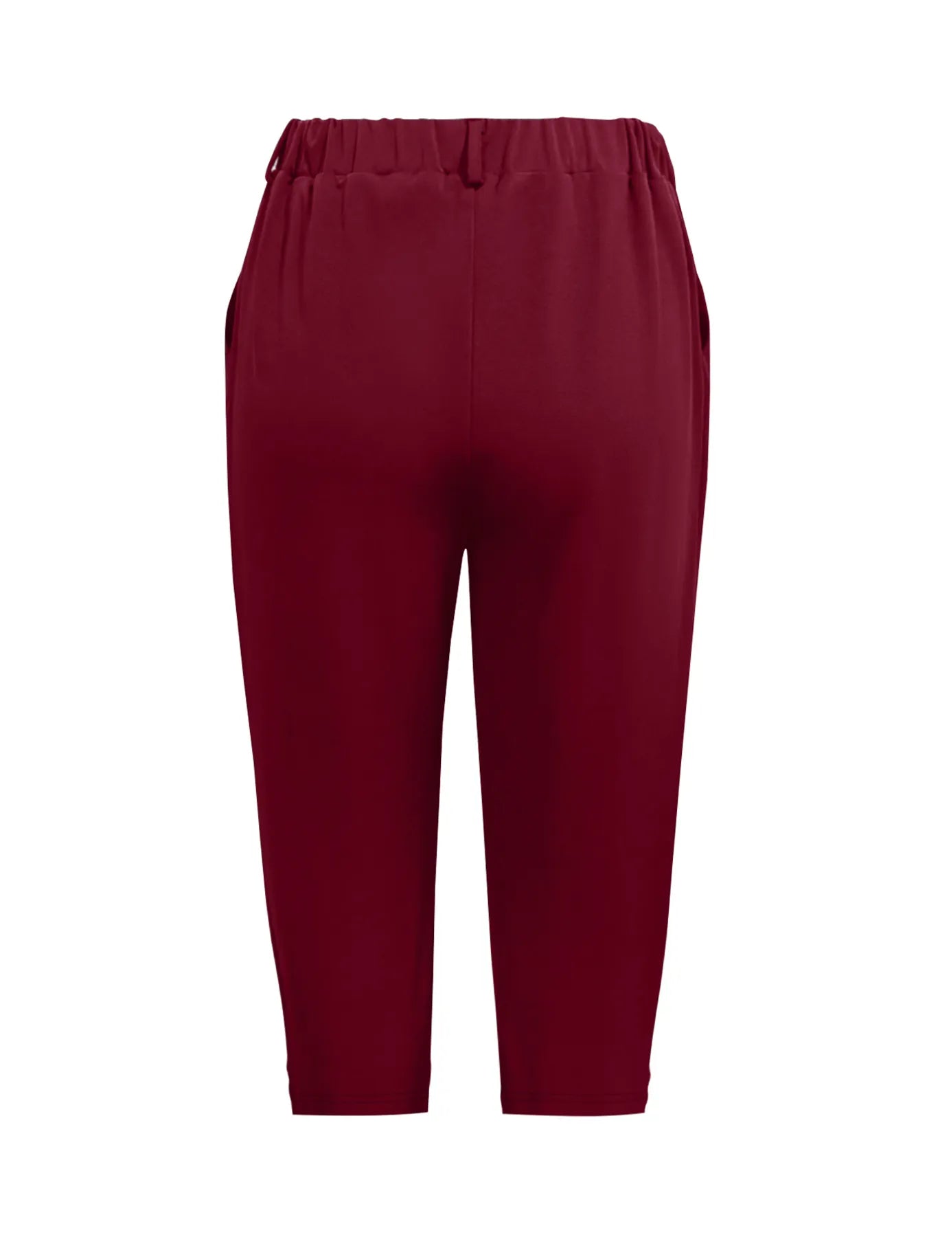 Model wearing pleated detail pants in burgundy