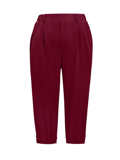 Flat lay of pleated detail pants in burgundy