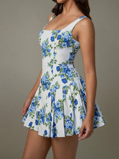 Side view showcasing the fit of pleated floral square neck mini dress in blue