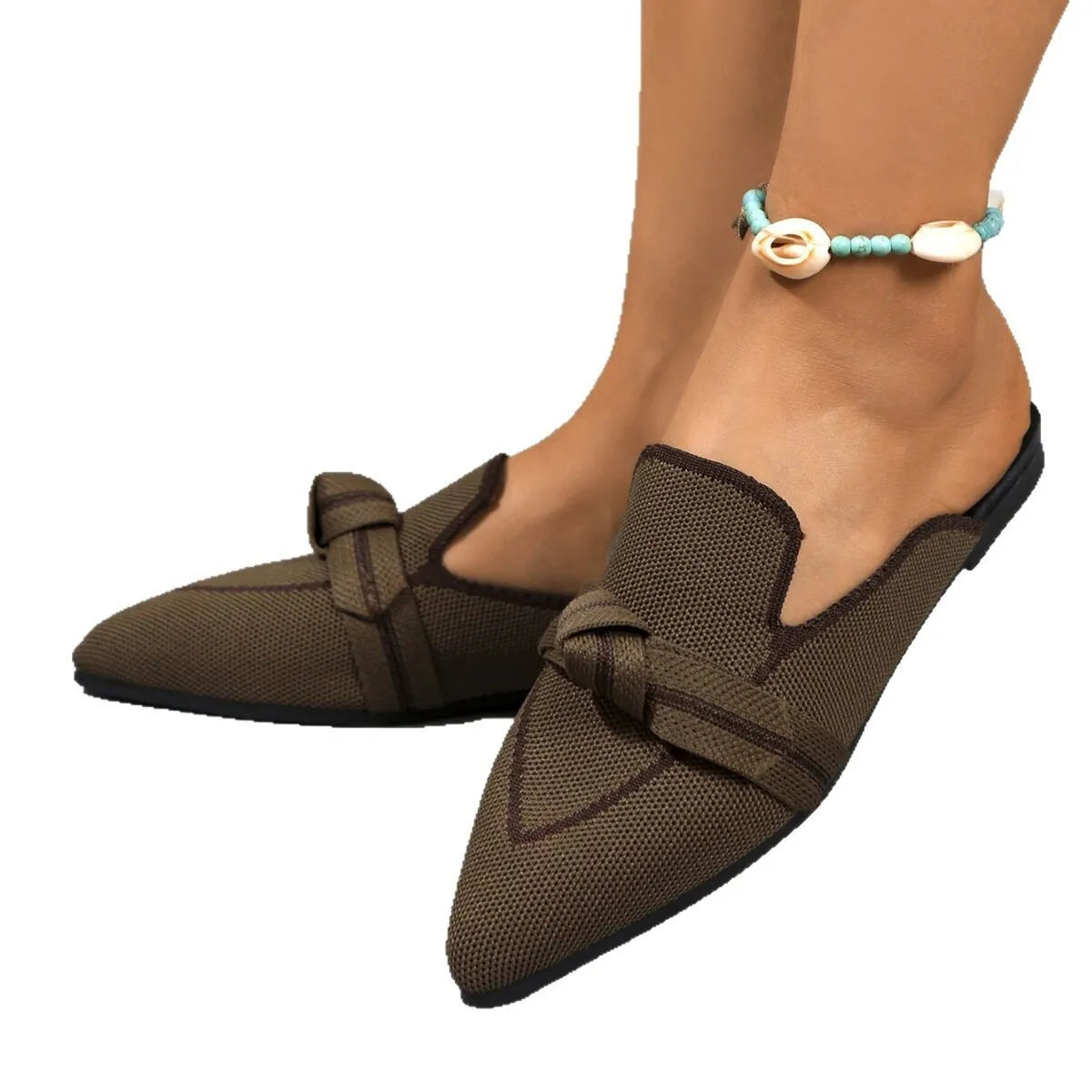 Side view of brown point toe flat slip-on shoes