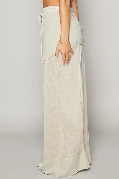 Side view showcasing the fit of POL Drawstring Wide Leg Pants in Cream