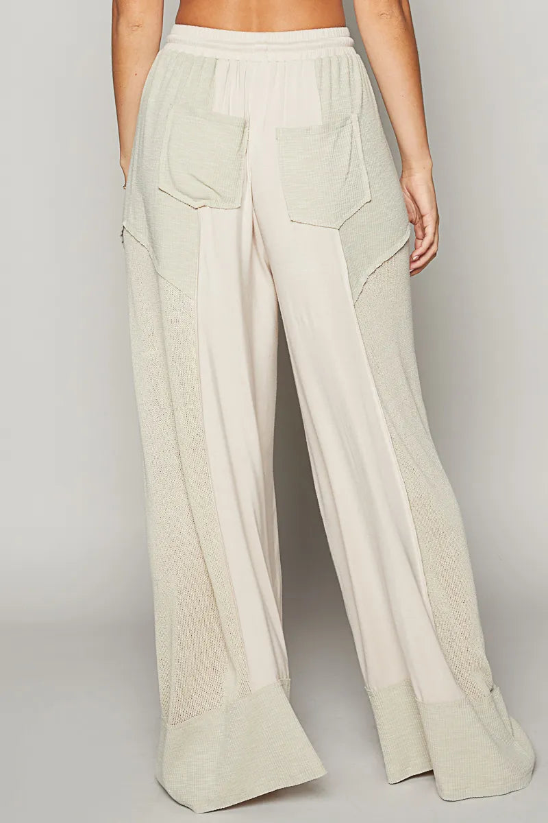 Back view highlighting the design of POL Drawstring Wide Leg Pants in Cream