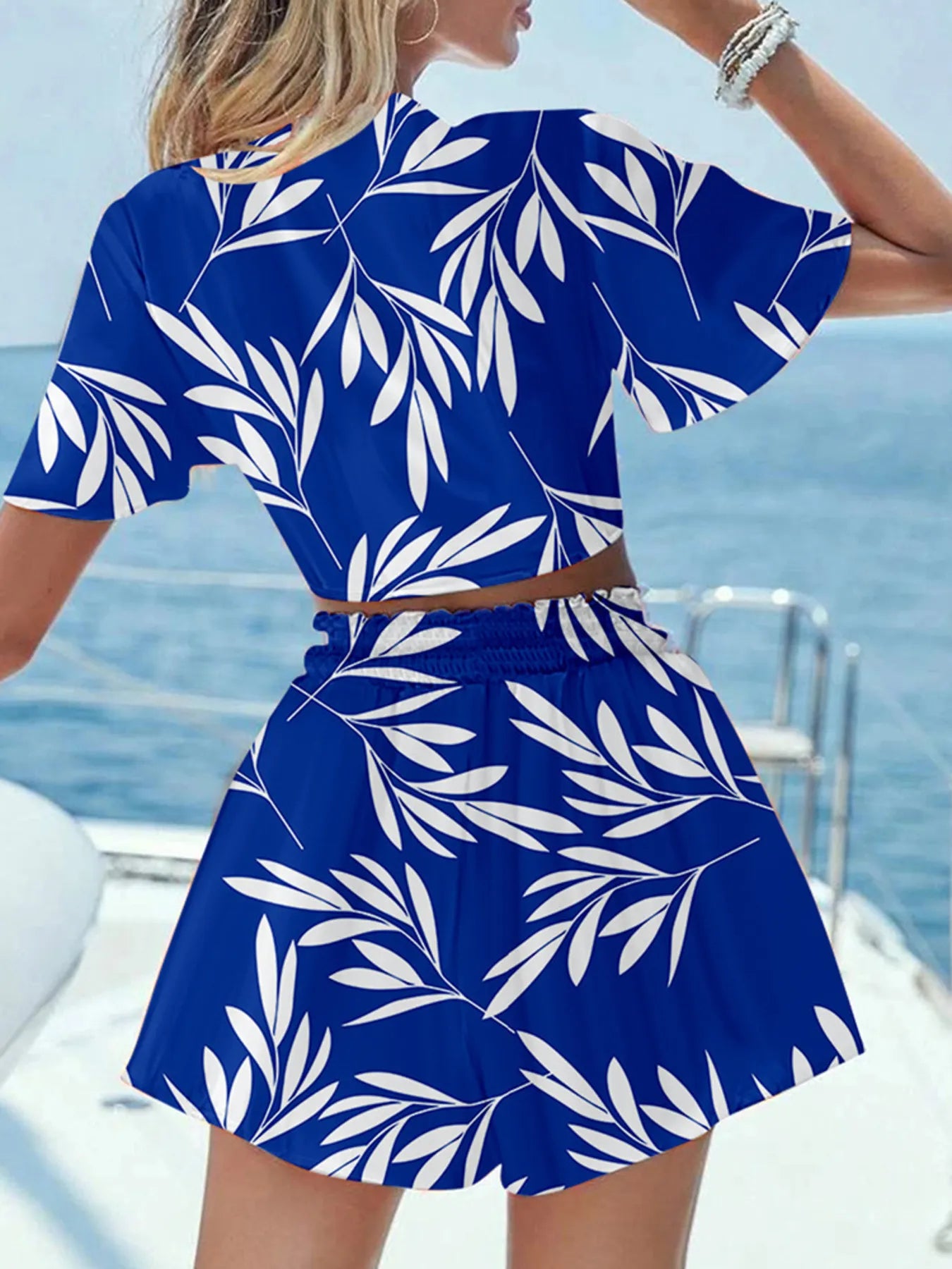 Back view highlighting the design of Printed Tie Front Top and Shorts Set in Dark Blue