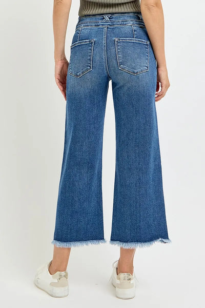 Close-up of the cropped hem of Risen High Rise Crop Wide Leg Jeans, emphasizing the clean cut and wide-leg silhouette.