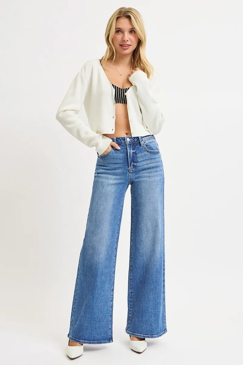 Model wearing Risen Full Size High Rise Wide Leg Jeans, demonstrating the trendy high-rise fit and wide-leg style.