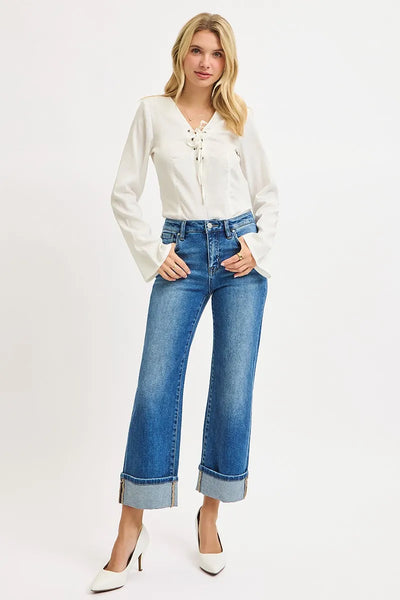 Model wearing Risen Full Size Mid Rise Crop Straight Cuffed Jeans, demonstrating the trendy straight-leg cut and cuffed ankle look.