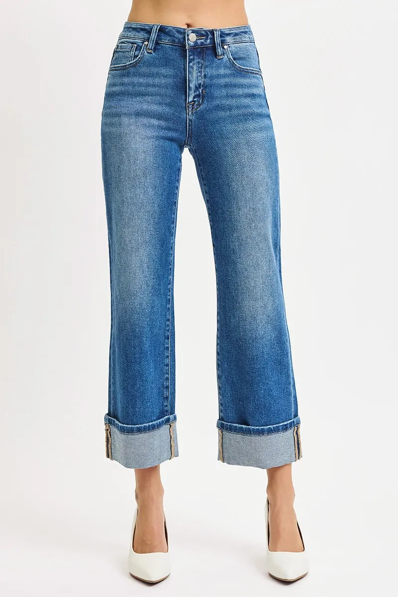 Side view of Risen Full Size Mid Rise Crop Straight Cuffed Jeans, showcasing the straight-leg cut and cuffed ankle design.