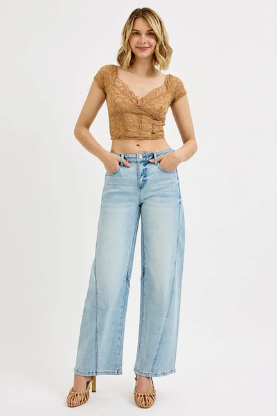 Model wearing Risen Full Size Mid Rise Fit Barrel Jeans, demonstrating the relaxed fit and flattering barrel-leg cut.