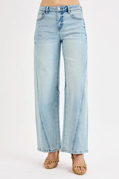 Side view of Risen Full Size Mid Rise Fit Barrel Jeans, showcasing the comfortable fit and barrel-leg silhouette.