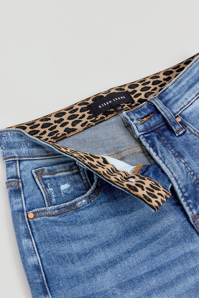 Angled view of Risen Full Size Tummy Control Elastic Band High Rise Wide Jeans, highlighting the relaxed fit and stylish high-rise waistband.