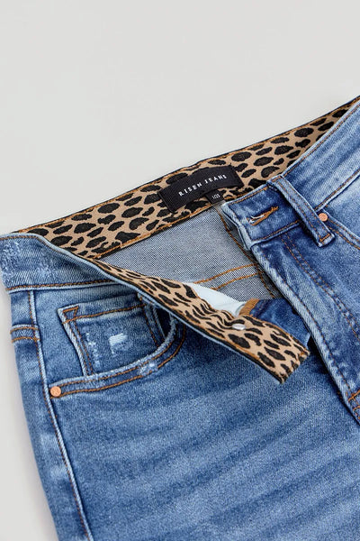 Angled view of Risen Full Size Tummy Control Elastic Band High Rise Wide Jeans, highlighting the relaxed fit and stylish high-rise waistband.