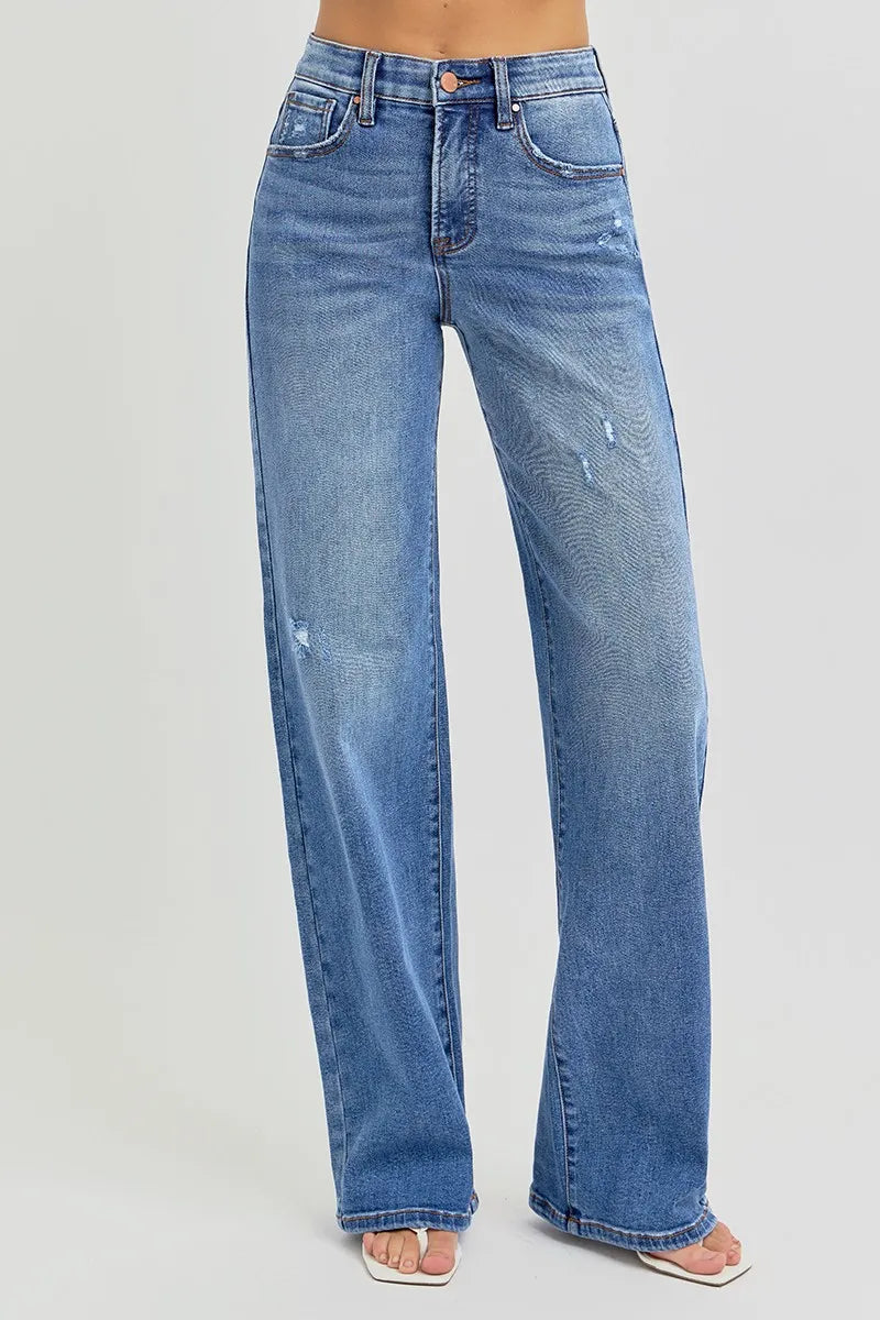Side view of Risen Full Size Tummy Control Elastic Band High Rise Wide Jeans, showcasing the wide-leg silhouette and comfortable fit.