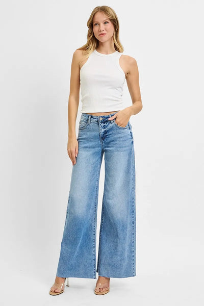 Model wearing Risen Full Size Tummy Control High Rise Ankle Palazzo Jeans, showcasing the comfortable fit and elegant palazzo style.
