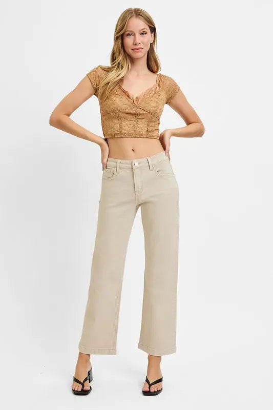 Model wearing Risen Full Size Tummy Control Mid Rise Ankle Straight Jeans, showcasing the flattering fit and ankle-length cut.