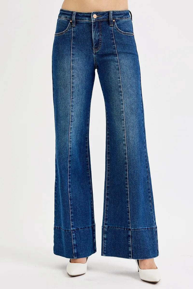 Side view of Risen Full Size Tummy Control Mid Rise Ankle Wide Flare Jeans, highlighting the mid-rise waist and wide flare silhouette.