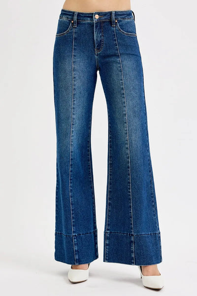 Side view of Risen Full Size Tummy Control Mid Rise Ankle Wide Flare Jeans, highlighting the mid-rise waist and wide flare silhouette.