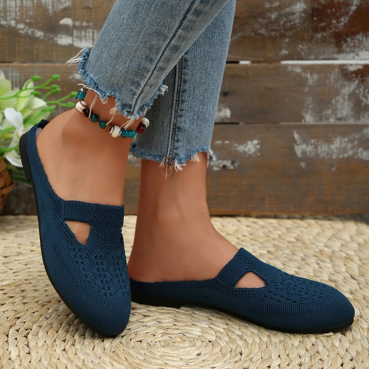 Angled back view of Round Toe Flat Slip-Ons, highlighting the flat sole and easy fit.