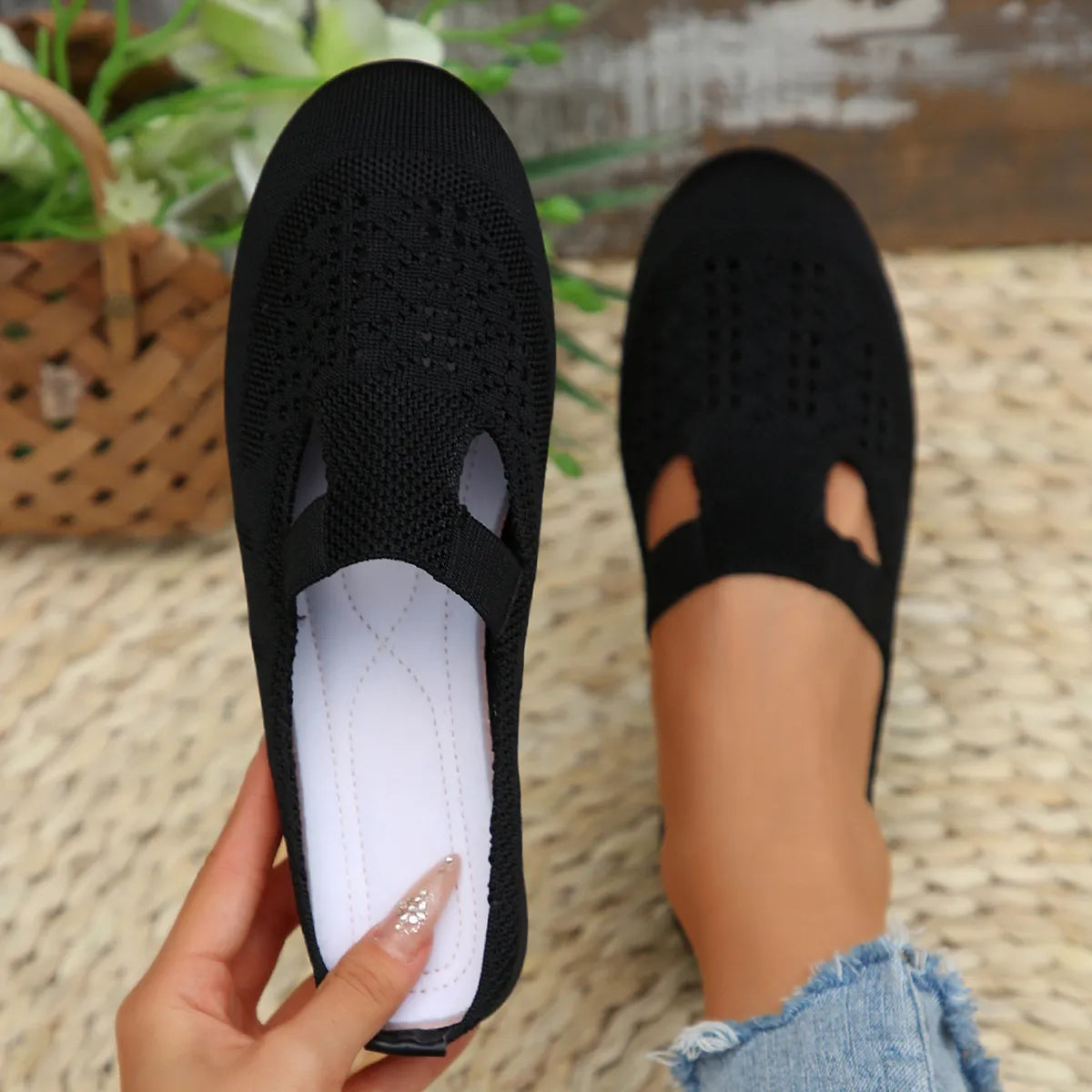 Side view of model wearing Round Toe Flat Slip-Ons, highlighting the sleek and comfortable design.