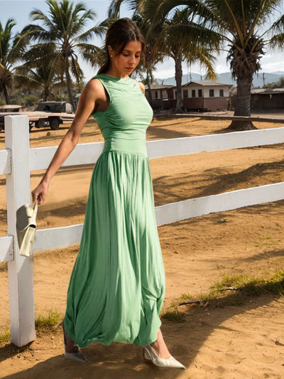Side view of Ruched Sleeveless Maxi Dress, showcasing the long, flowing silhouette and ruched detailing.