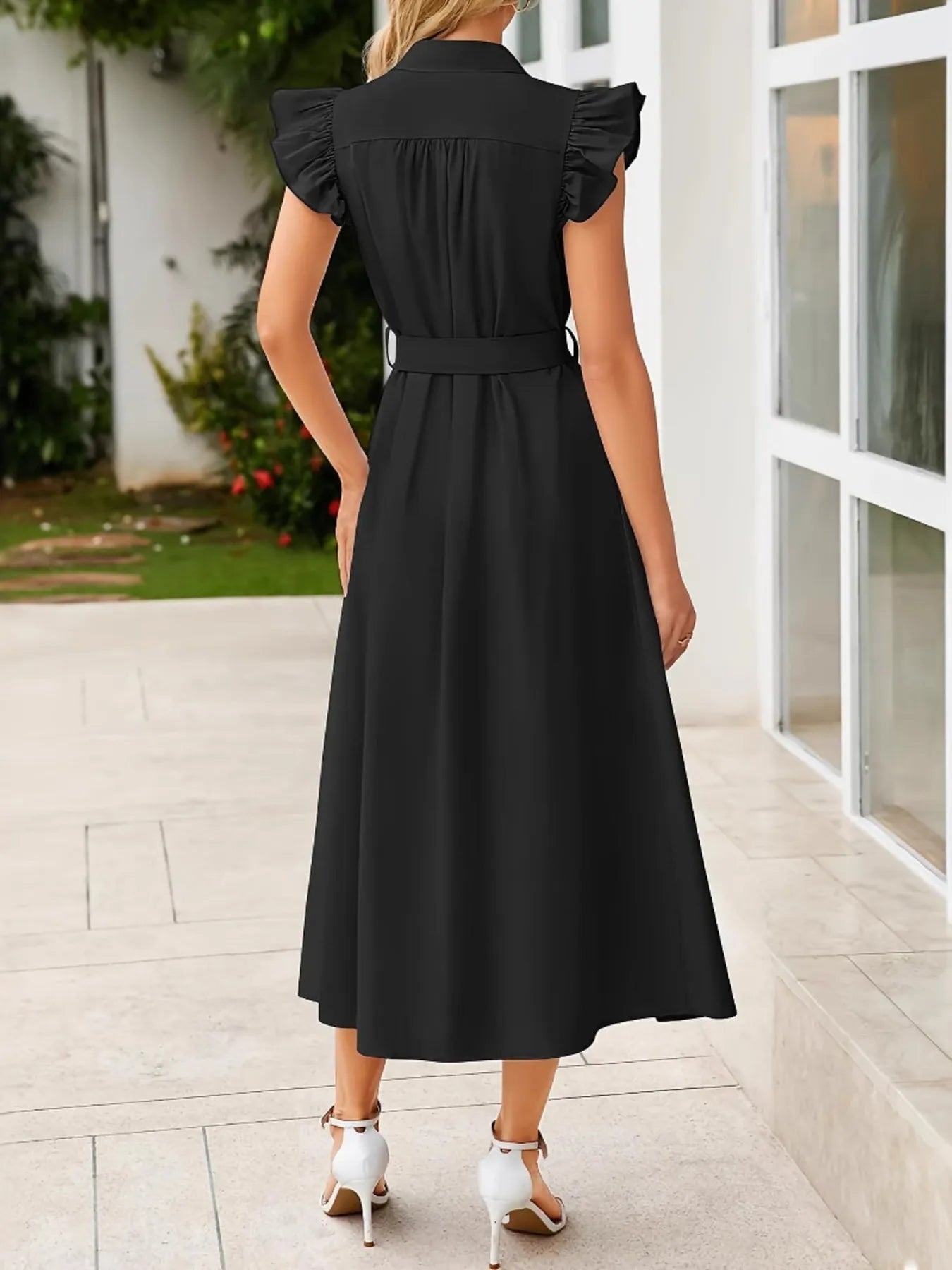 Side view of Ruffled Button Front Midi Dress, showcasing the flowy skirt and fitted waist.