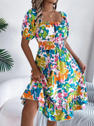 Full-body view of model wearing Ruffled Hem Smocked Floral Short Sleeve Midi Dress, showcasing the overall look and fit.