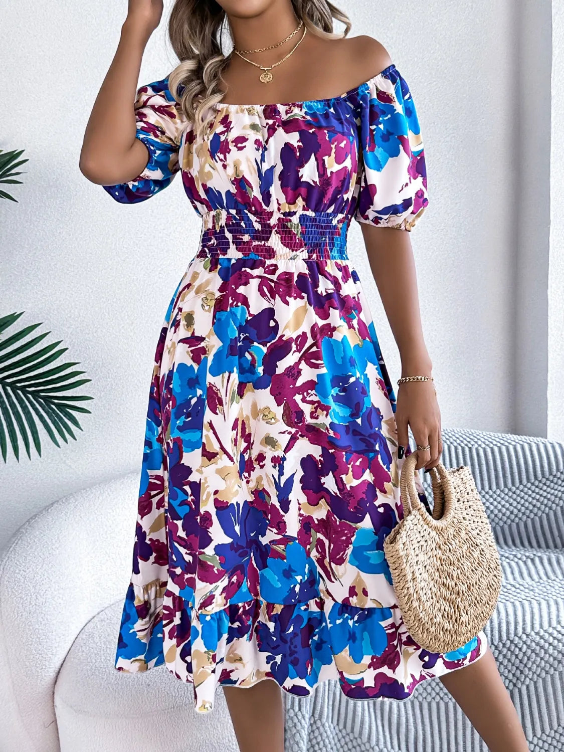 Close-up of the ruffled hem on Ruffled Hem Smocked Floral Short Sleeve Midi Dress, highlighting the playful and stylish design.