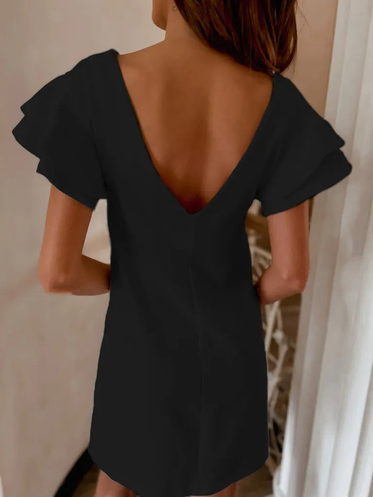 Back view highlighting the design of Ruffled Layered Short Sleeve Mini Dress in Black