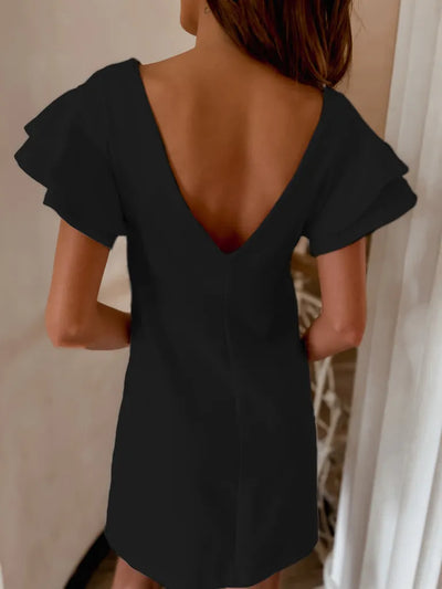 Back view highlighting the design of Ruffled Layered Short Sleeve Mini Dress in Black
