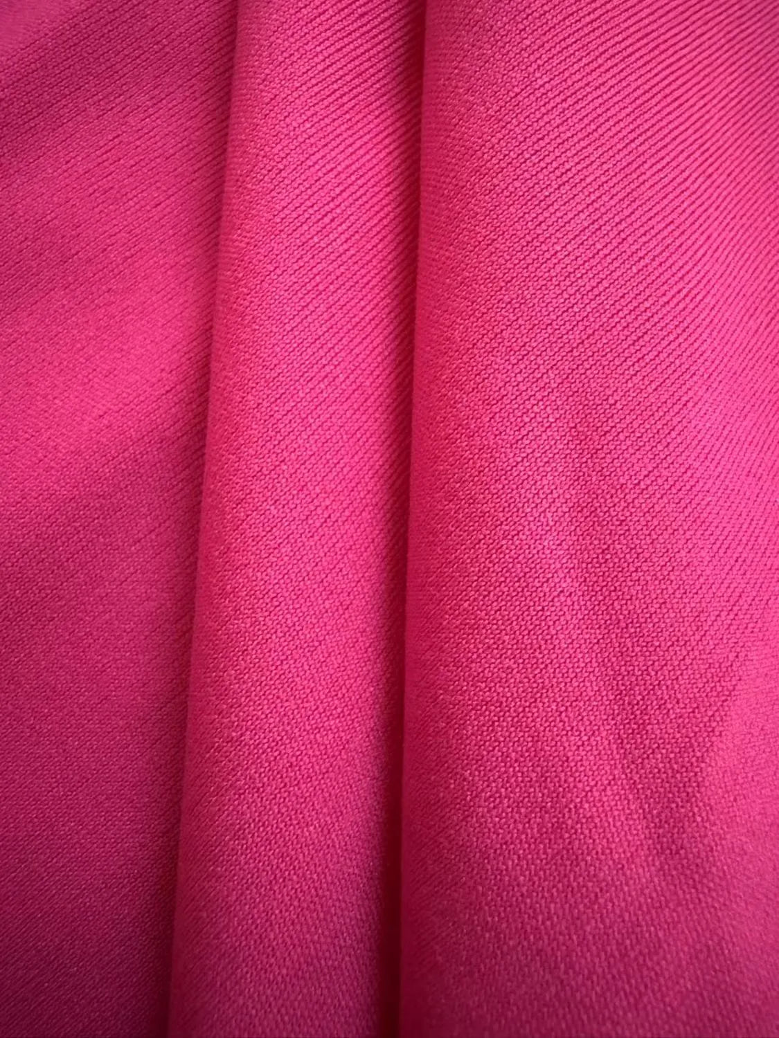 Model wearing Ruffled Layered Short Sleeve Mini Dress in Hot Pink