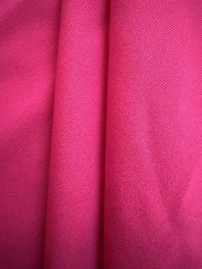 Model wearing Ruffled Layered Short Sleeve Mini Dress in Hot Pink