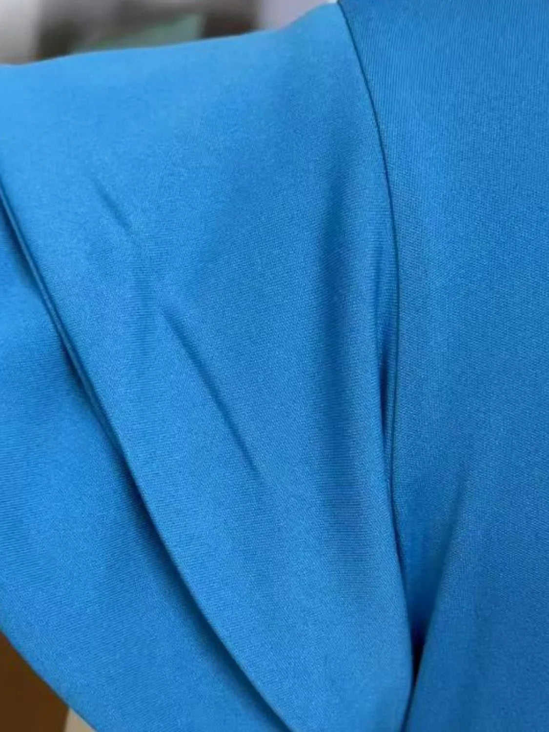 Model wearing Ruffled Layered Short Sleeve Mini Dress in Sky Blue