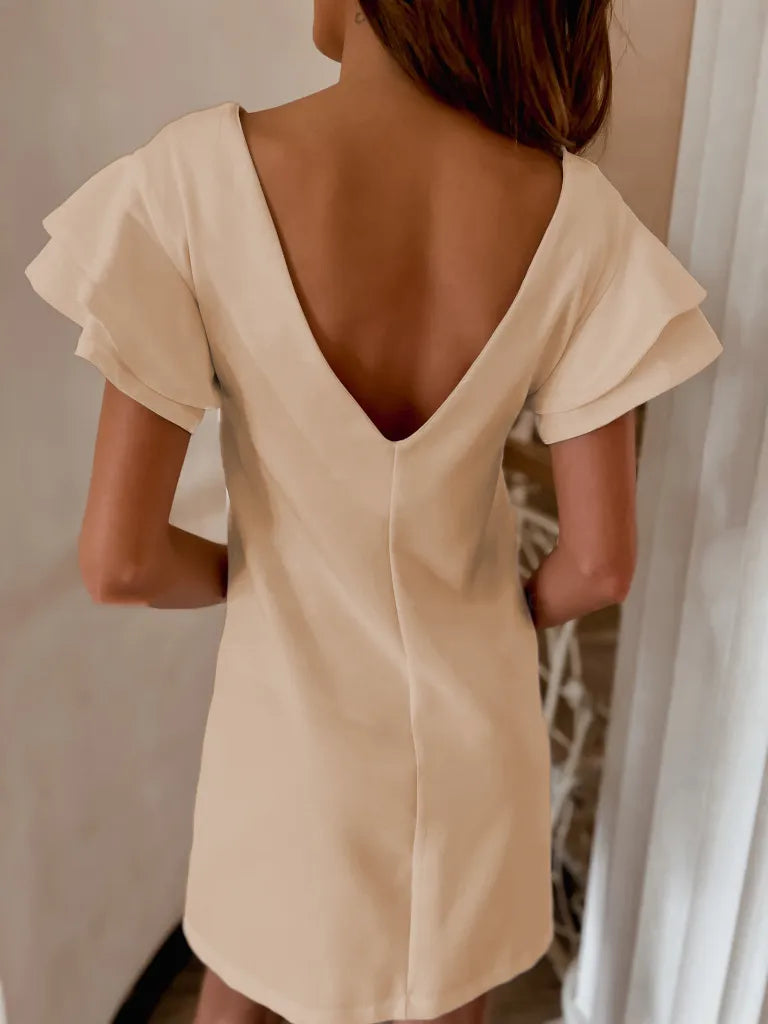 Back view highlighting the design of Ruffled Layered Short Sleeve Mini Dress in Tan