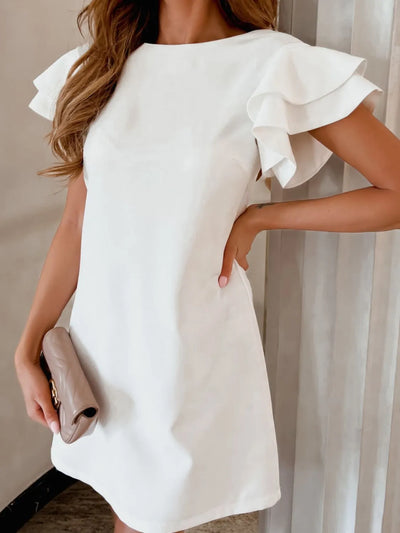 Side view showcasing the fit of Ruffled Layered Short Sleeve Mini Dress in White