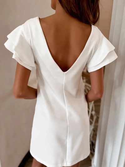 Back view highlighting the design of Ruffled Layered Short Sleeve Mini Dress in White