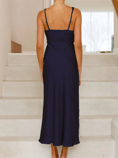 Back view highlighting the design of Satin Asymmetrical Midi Dress in Dark Blue