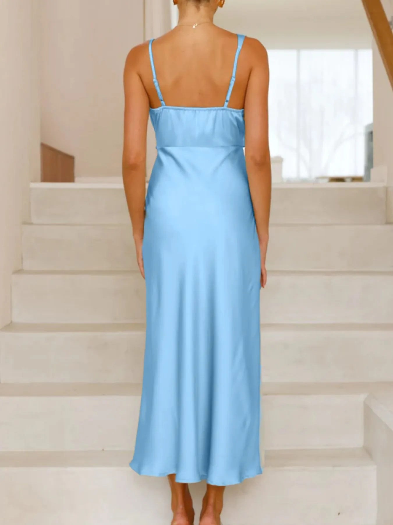 Back view highlighting the design of Satin Asymmetrical Midi Dress in Light Blue