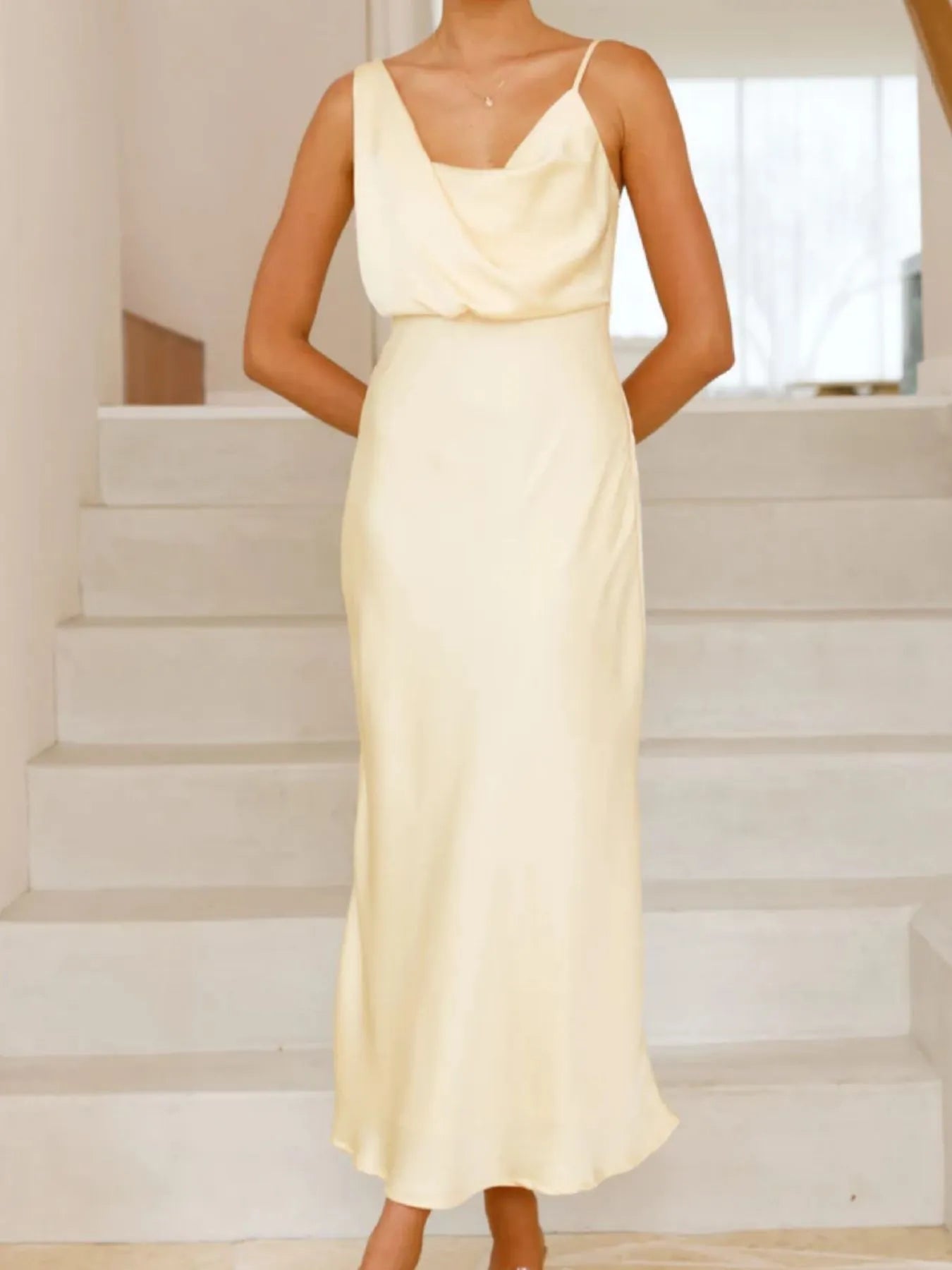 Back view highlighting the design of Satin Asymmetrical Midi Dress in Light Yellow