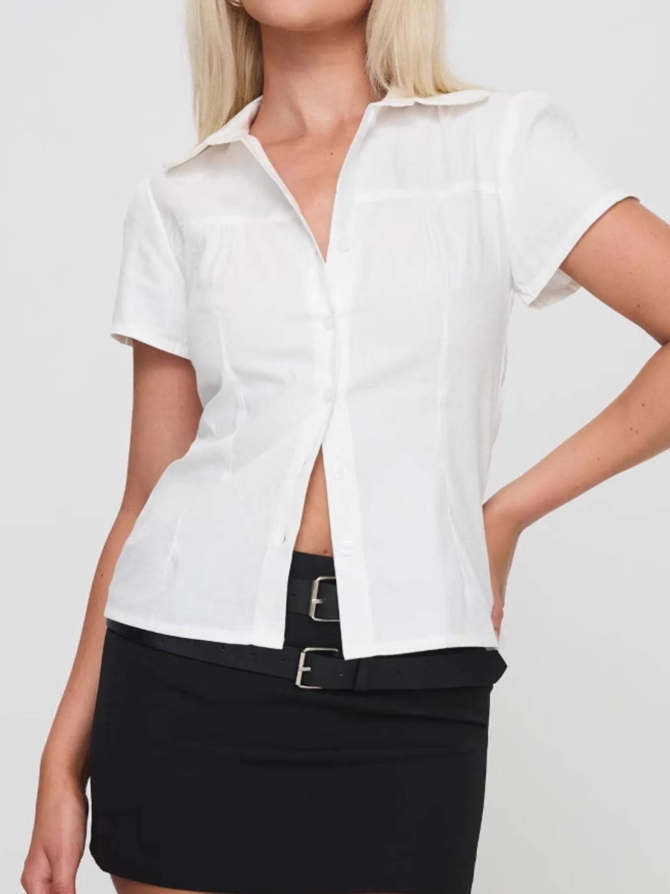 Side view showcasing the fit of Short Sleeve Button-Up Shirt in White