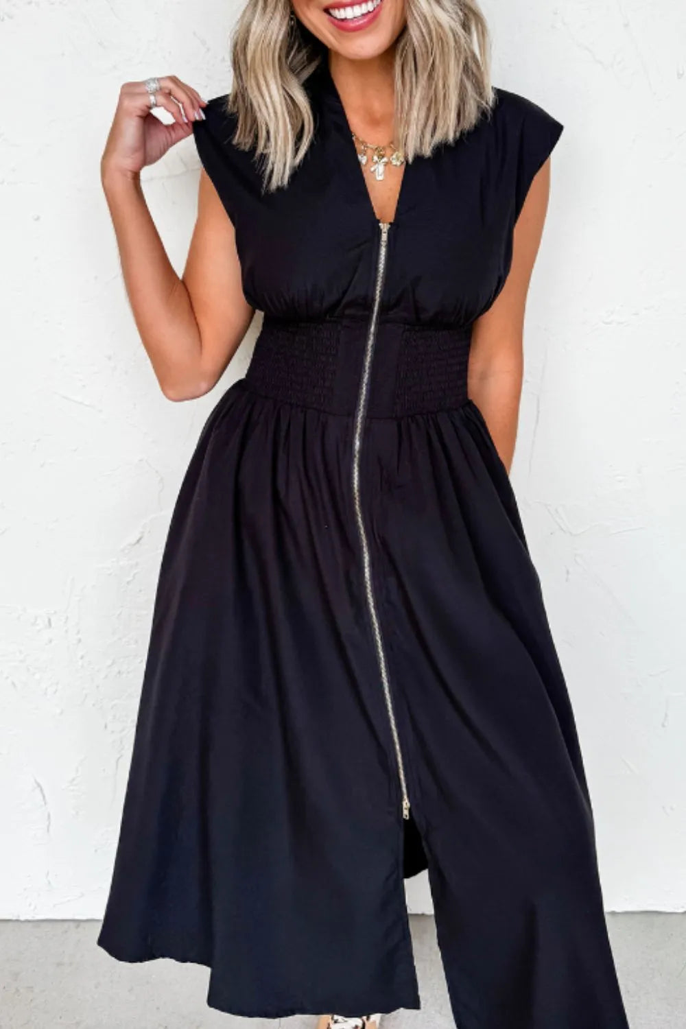 Back view highlighting the design of Sleeveless Zip-Front Maxi Dress in Black