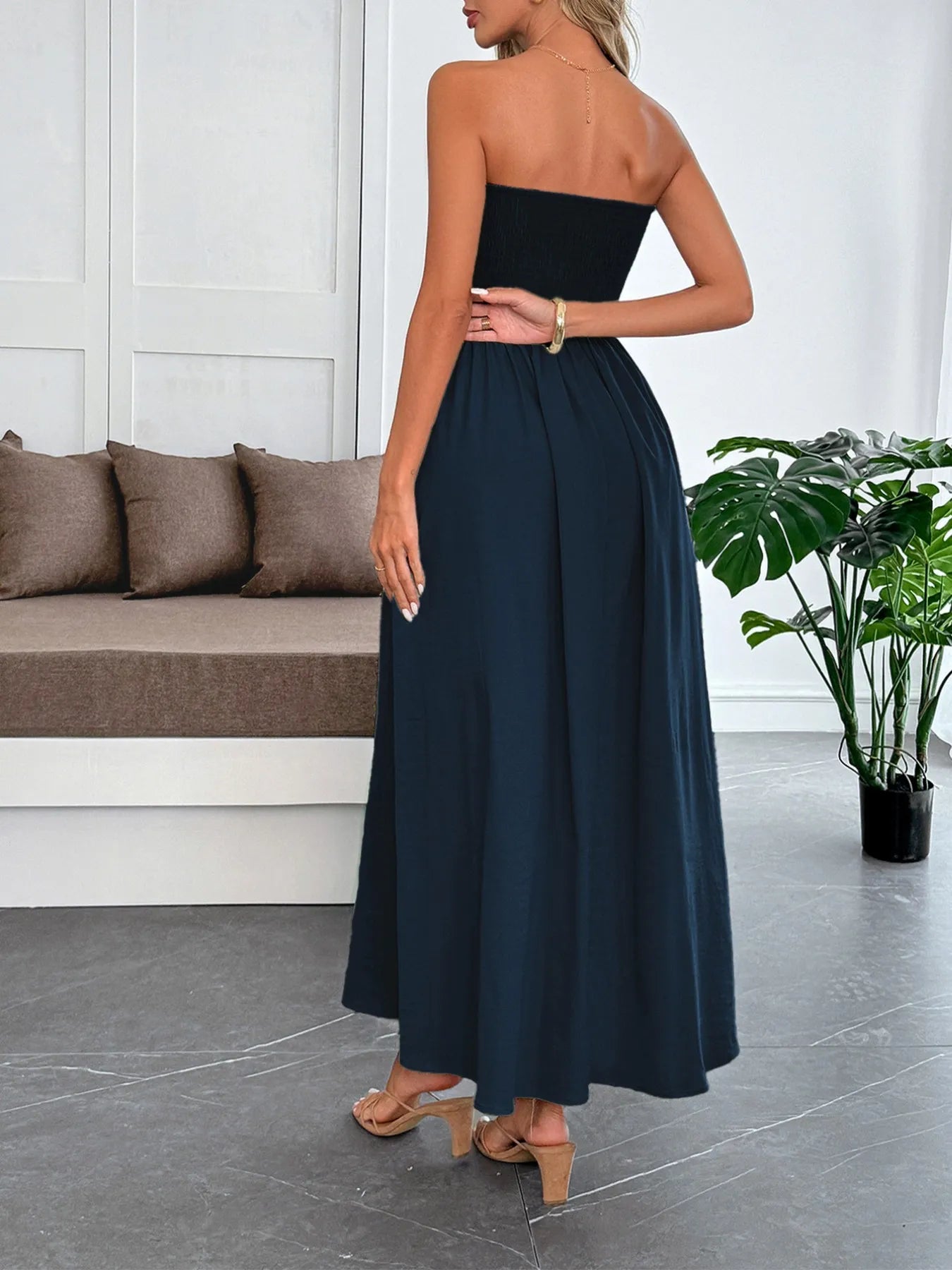 Side view showcasing the fit of Smocked Tube Maxi Dress in Black