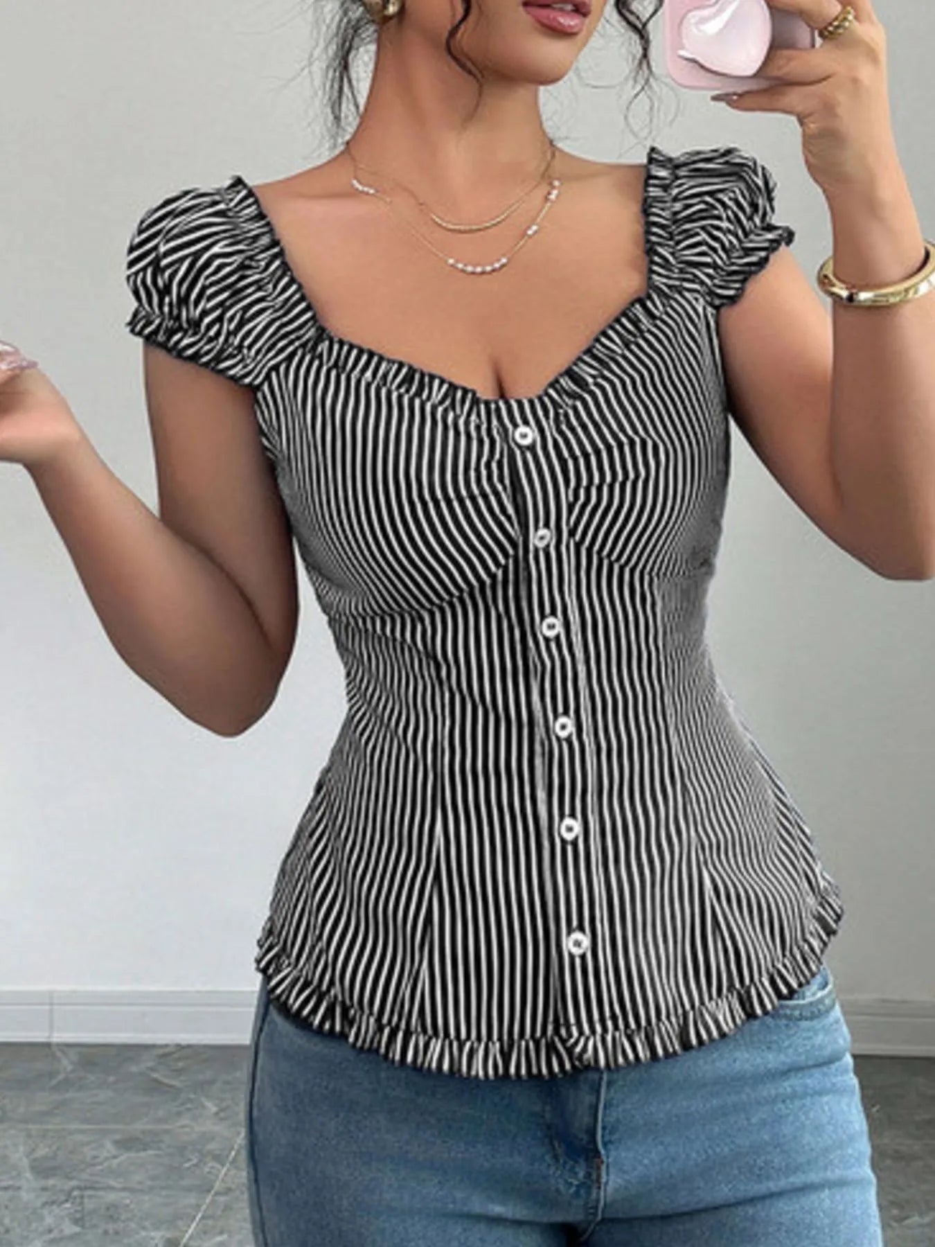 Back view highlighting the design of Striped Cap Sleeve Shirt in Black